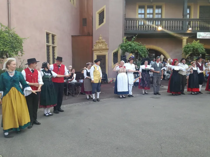 Folklore dancing in the evening at Colmar, Alsace (France)